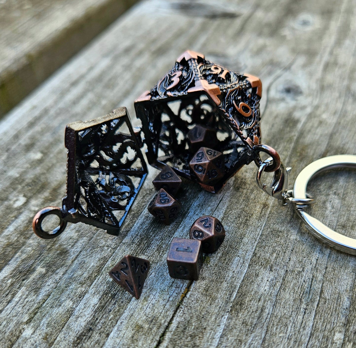 Metal d20 keychain with matching dice
