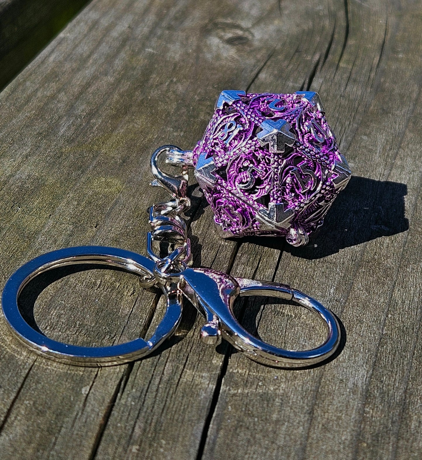 Metal d20 keychain with matching dice