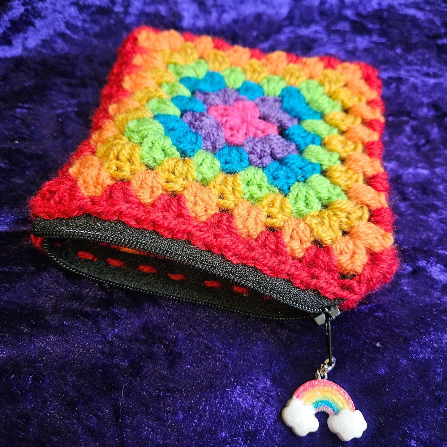 Handmade rainbow crochet dice pouch